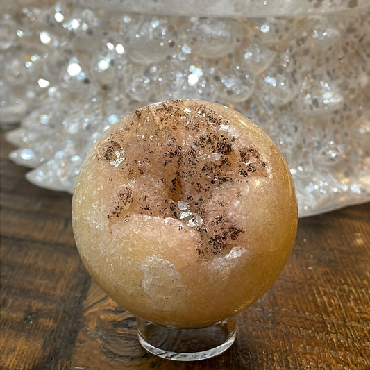 Pink Amethyst Druzy Sphere, a radiant and enchanting crystal ball showcasing delicate crystalline formations in soothing pink tones.