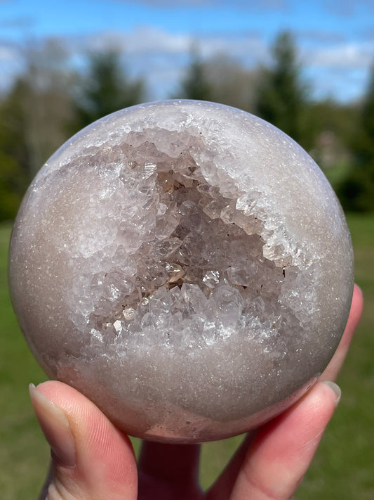 Pink Amethyst Sphere: Radiant crystal ball with delicate pink tones