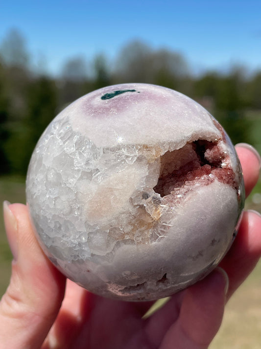 Pink Amethyst Sphere: Radiant crystal ball with delicate pink tones