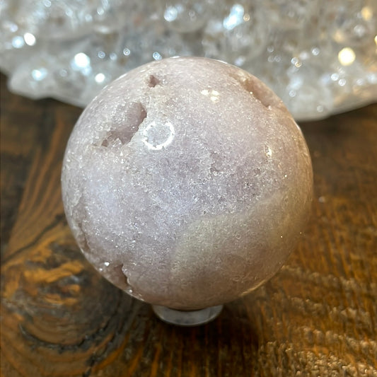 Pink Amethyst Druzy Sphere, a radiant and enchanting crystal ball showcasing delicate crystalline formations in soothing pink tones.