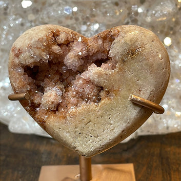 Pink Amethyst druzy hearts elagantly presented on custom metal stands, blending romance and sophistication in a crystalline showcase.