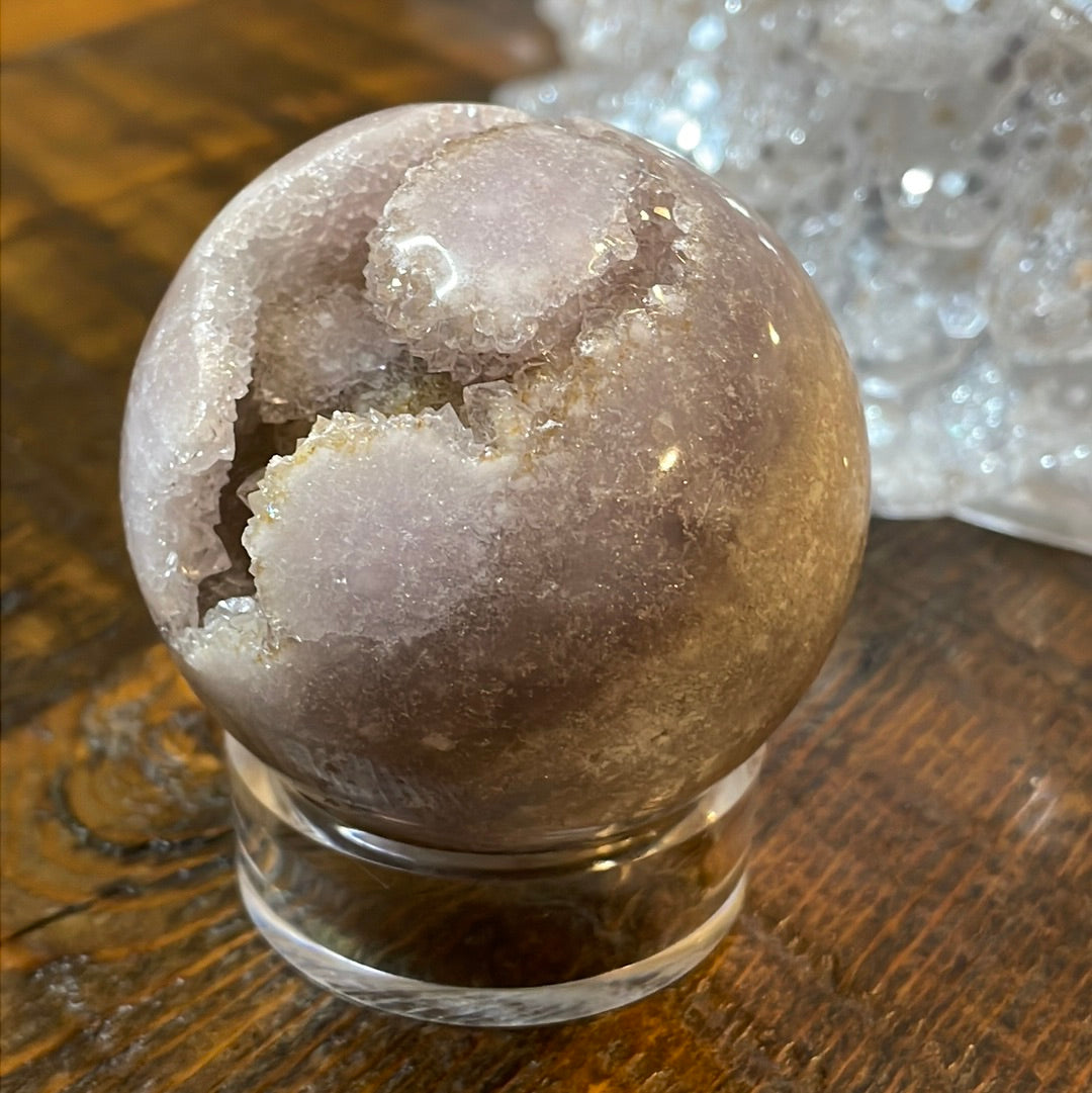 Pink Amethyst Druzy Sphere, a radiant and enchanting crystal ball showcasing delicate crystalline formations in soothing pink tones.