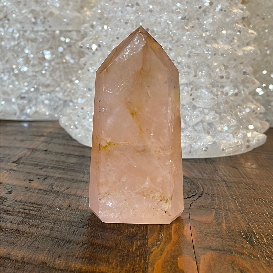 Elegant Rose Quartz tower, featuring soft pink tones, with golden healer and a graceful crystal formation for a serene and enchanting aesthetic