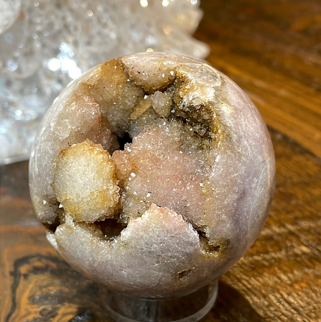 Pink Amethyst Druzy Sphere, a radiant and enchanting crystal ball showcasing delicate crystalline formations in soothing pink tones.
