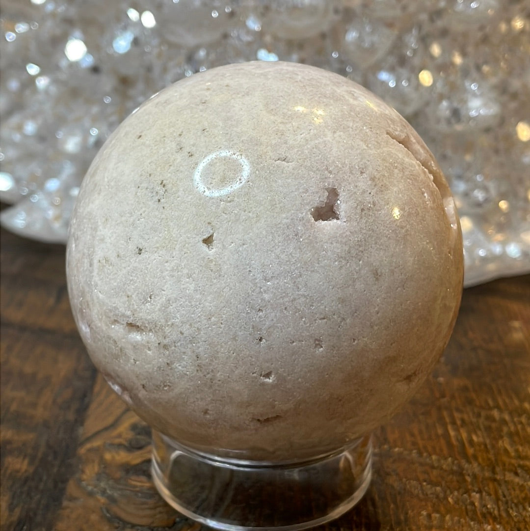 Pink Amethyst Druzy Sphere, a radiant and enchanting crystal ball showcasing delicate crystalline formations in soothing pink tones.