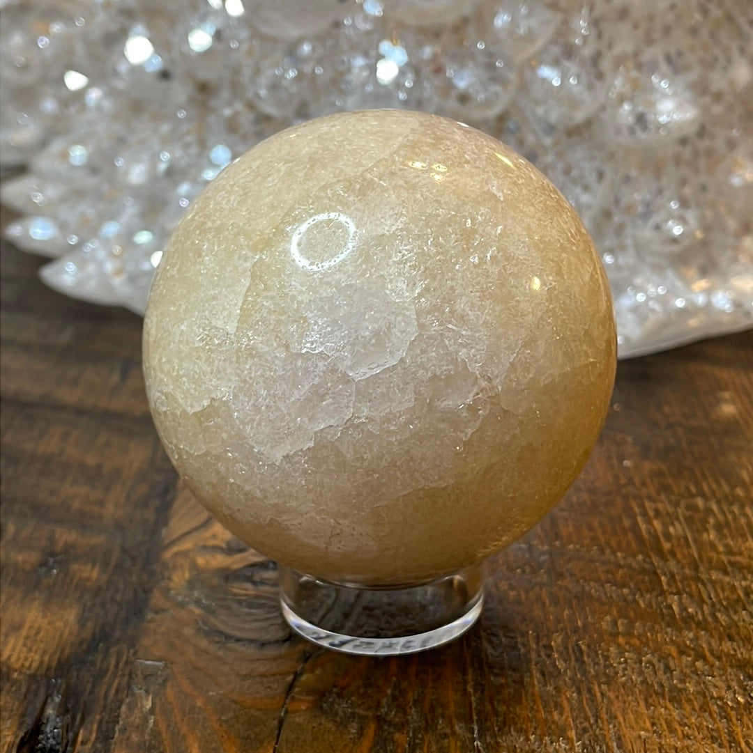 Pink Amethyst Druzy Sphere, a radiant and enchanting crystal ball showcasing delicate crystalline formations in soothing pink tones.