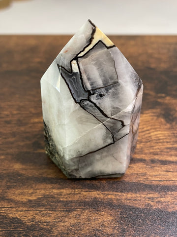 Mosaic Quartz, a captivating arrangement of Quartz crystals forming a mosaic-like pattern, showcasing the intricate beauty of nature's geological artistry in various shades and textures.