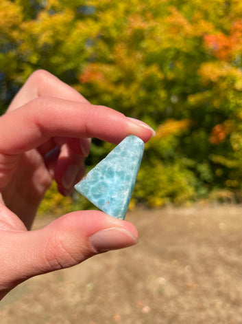 Light blue with soft white lines, triangular in shape with polished surface. It has effects on four of the seven Chakras