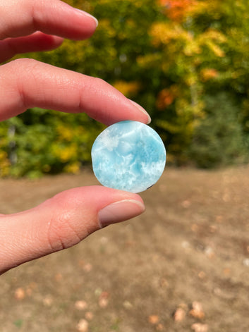 Light blue with soft white lines, round in shape with polished surface. It has effects on four of the seven Chakras