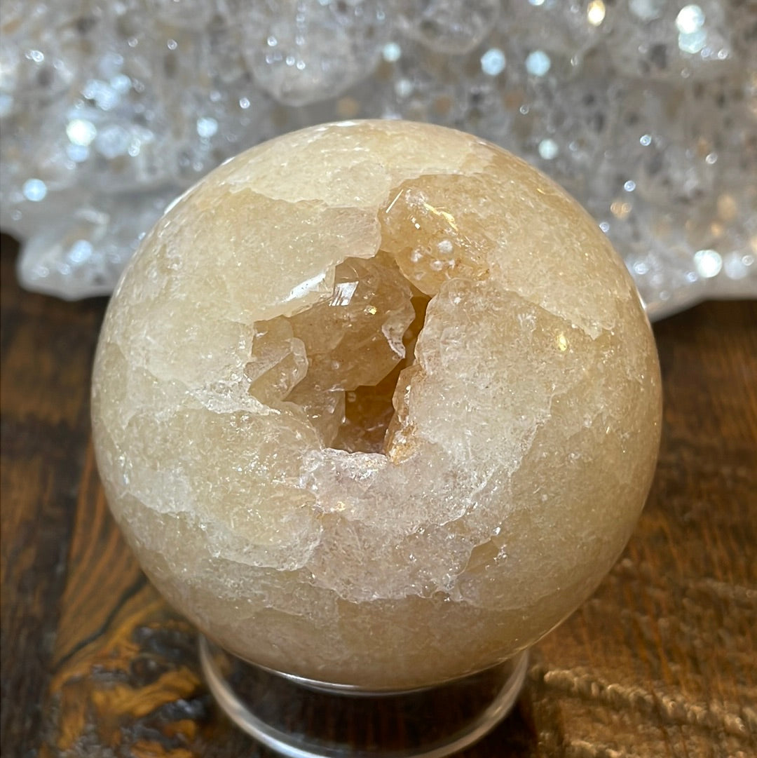 Pink Amethyst Druzy Sphere, a radiant and enchanting crystal ball showcasing delicate crystalline formations in soothing pink tones.