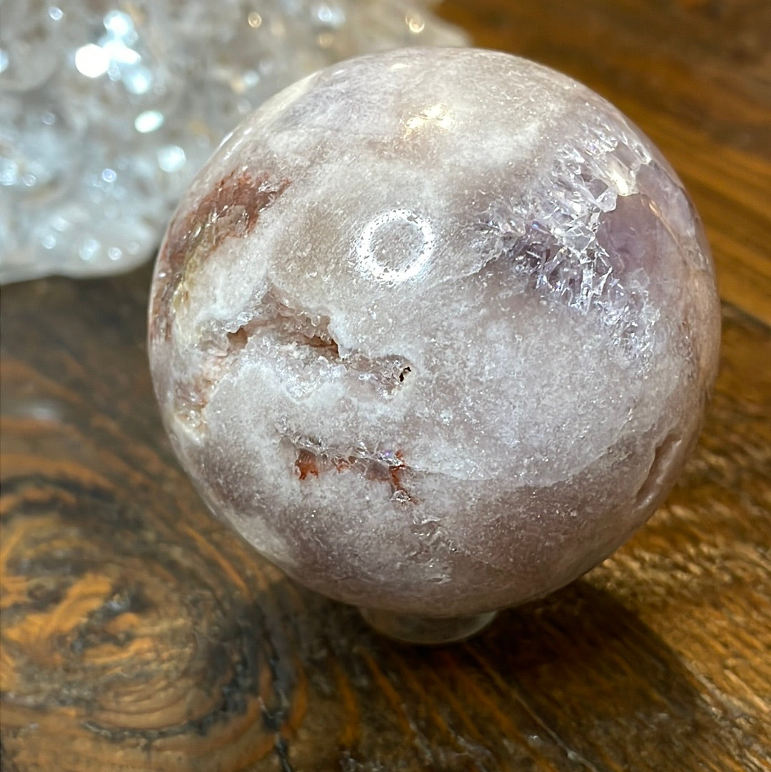 Pink Amethyst Druzy Sphere, a radiant and enchanting crystal ball showcasing delicate crystalline formations in soothing pink tones.