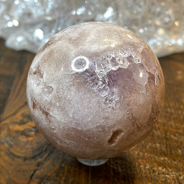 Pink Amethyst Druzy Sphere, a radiant and enchanting crystal ball showcasing delicate crystalline formations in soothing pink tones.