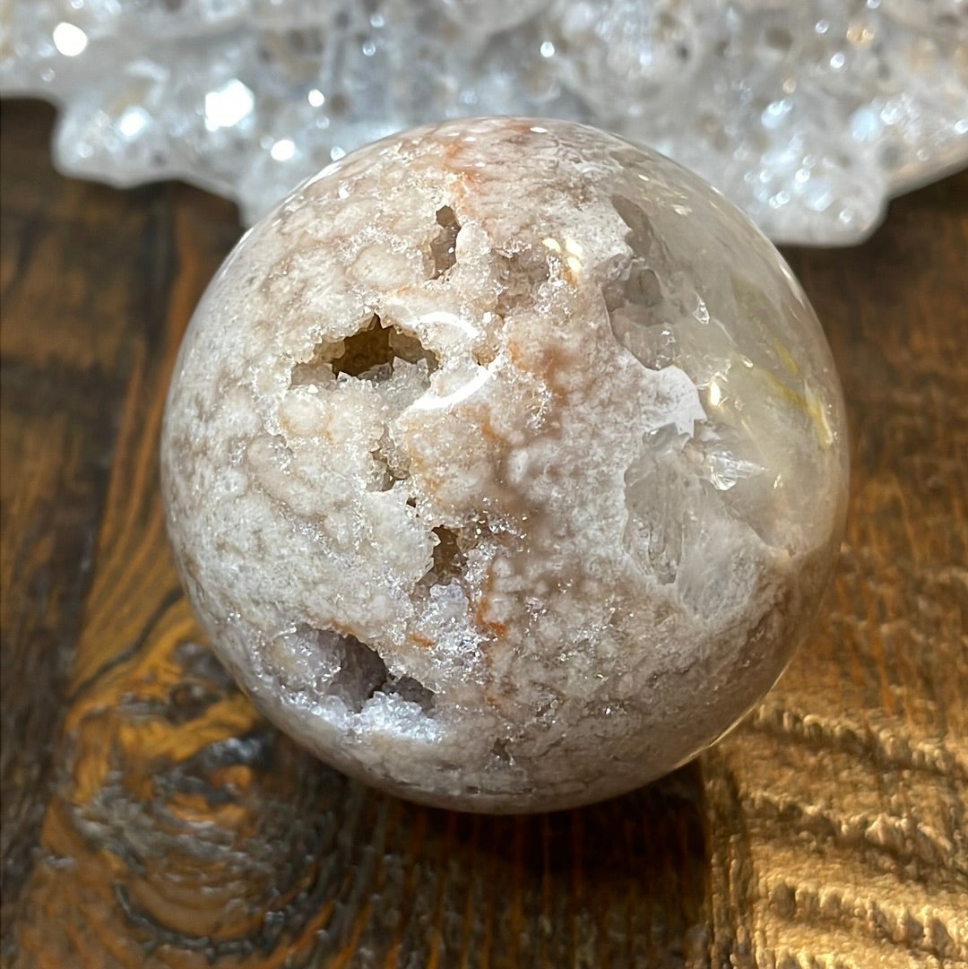 Pink Amethyst Druzy Sphere, a radiant and enchanting crystal ball showcasing delicate crystalline formations in soothing pink tones.