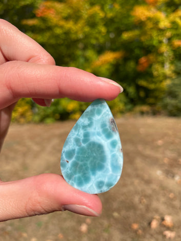 Light blue with soft white lines, Tear drop in shape with beautiful Turtle back effect, with polished surface. It has effects on four of the seven Chakras.