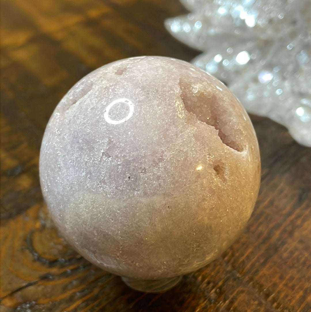 Pink Amethyst Druzy Sphere, a radiant and enchanting crystal ball showcasing delicate crystalline formations in soothing pink tones.