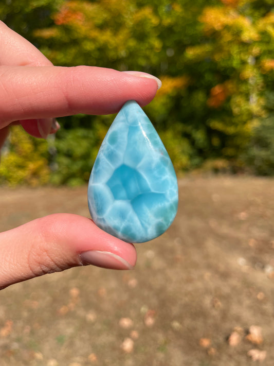 Light blue with soft white lines, Tear drop in shape with beautiful Turtle back effect, with polished surface. It has effects on four of the seven Chakras.