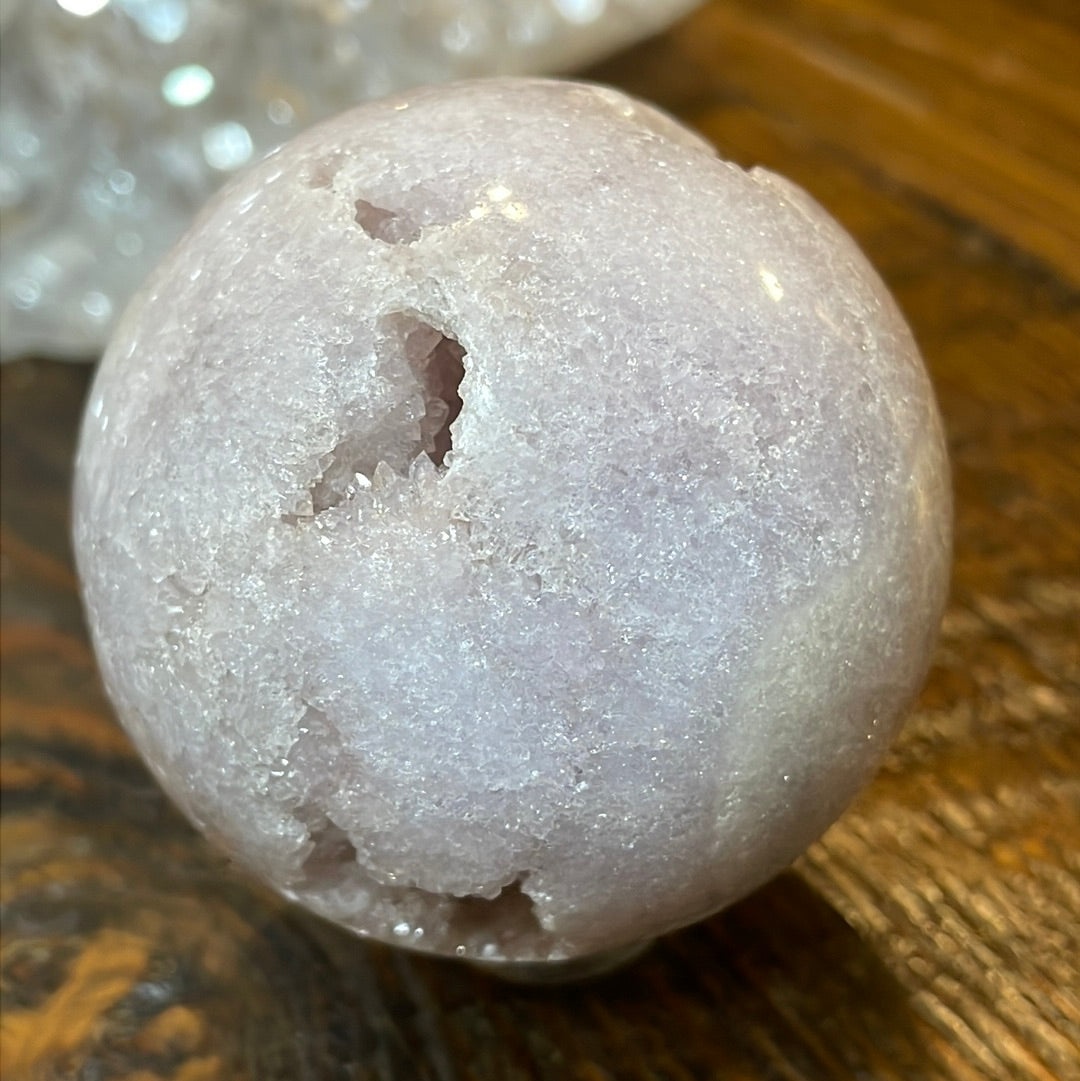 Pink Amethyst Druzy Sphere, a radiant and enchanting crystal ball showcasing delicate crystalline formations in soothing pink tones.