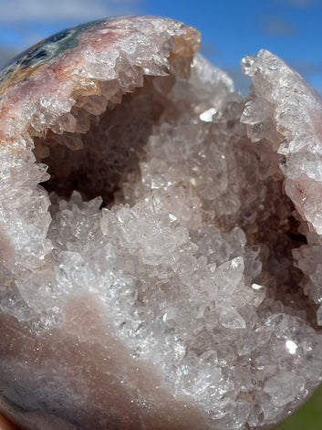 Pink Amethyst Sphere: Radiant crystal ball with delicate pink tones