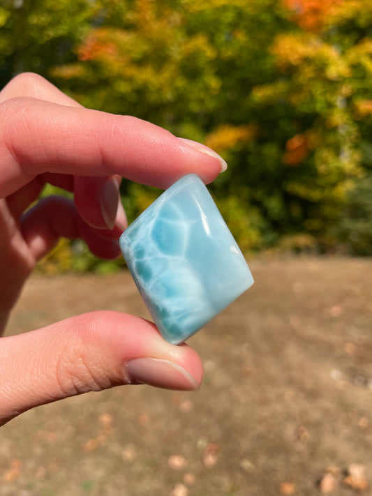 Light blue with soft white lines, Diamond in shape, with polished surface. It has effects on four of the seven Chakras.