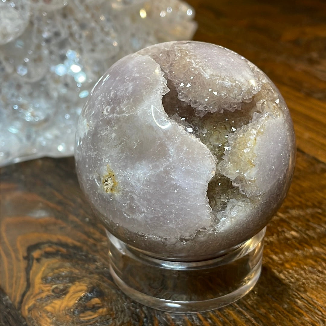Pink Amethyst Druzy Sphere, a radiant and enchanting crystal ball showcasing delicate crystalline formations in soothing pink tones.