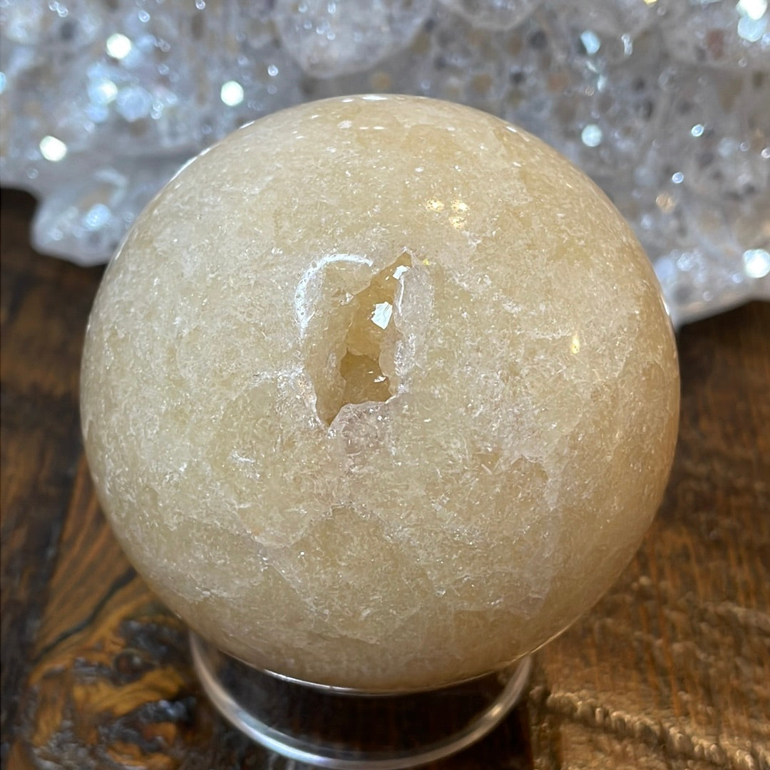 Pink Amethyst Druzy Sphere, a radiant and enchanting crystal ball showcasing delicate crystalline formations in soothing pink tones.