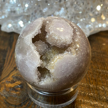 Pink Amethyst Druzy Sphere, a radiant and enchanting crystal ball showcasing delicate crystalline formations in soothing pink tones.