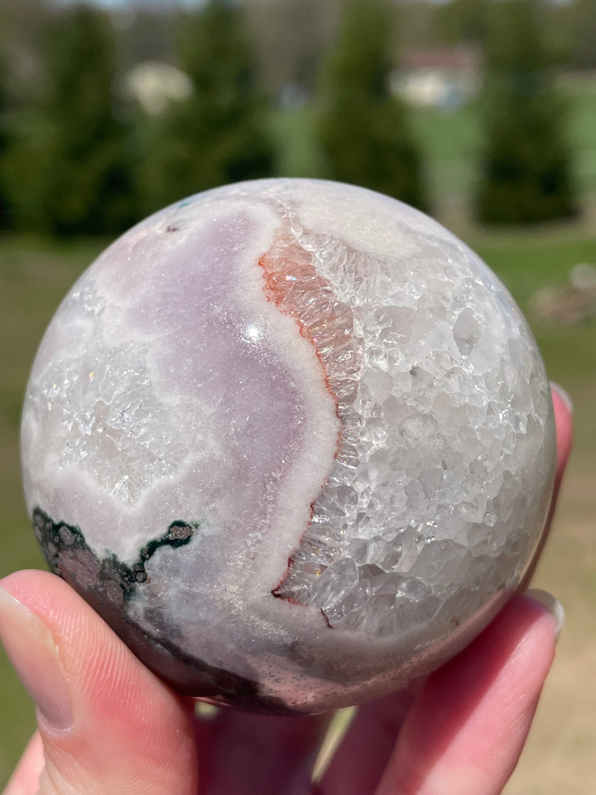 Pink Amethyst Sphere: Radiant crystal ball with delicate pink tones