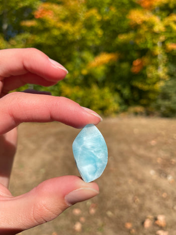Light blue with soft white lines, tear drop in shape with polished surface. It has effects on four of the seven Chakras
