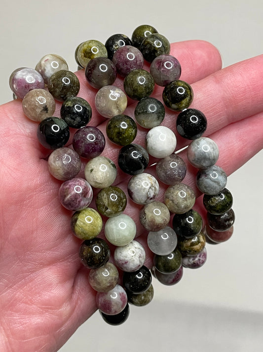 Colorful Tourmaline bracelet featuring 8mm beads, showcasing a vibrant array of tourmaline crystals in various hues. This bracelet combines natural beauty with a lively and cheerful aesthetic, making it a stylish and eye-catching accessory for any occasion.