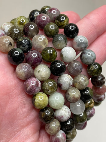 Colorful Tourmaline bracelet featuring 8mm beads, showcasing a vibrant array of tourmaline crystals in various hues. This bracelet combines natural beauty with a lively and cheerful aesthetic, making it a stylish and eye-catching accessory for any occasion.
