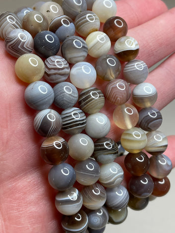 Botswana Agate bracelet featuring 8mm beads, displaying the natural beauty and unique patterns of Botswana agate stones. this bracelet combines earthy tones with captivating designs, creating a stylish and grounding accessory.