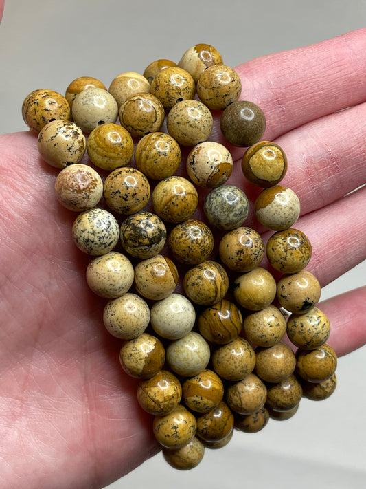 Picture jasper bracelet featuring 8mm beads, adorned with unique scenic patterns resembling landscapes, capturing  the essence of nature's artistry in this earthy and visually intriguing accessory.