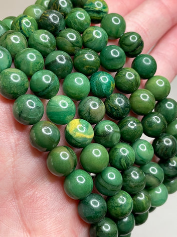 African Jade bracelet adorned with 8mm beads, showcasing the lush green hues of the African jade gemstone. This bracelet combines natural beauty with a touch of tranquility, making it a delightful accessory for any occasion.
