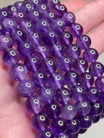 Light Amethyst bracelet adorned with 8mm beads, showcasing the soft and delicate lavender tones of amethyst crystals. This bracelet exudes a subtle elegance and a touch of serenity, making it a charming accessory for various occasions.