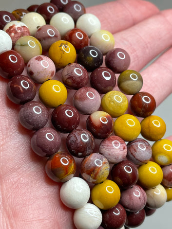 Mookaite Jasper bracelet with 8mm beads, displaying the warm and earthy tones of Mookaite Jasper crystals. This bracelet combines natural beauty with a grounding aesthetic, making it a stylish and calming accessory for various occasions.