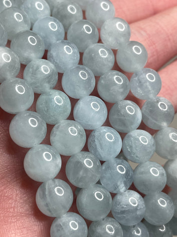 Aquamarine bracelet with 8mm beads, featuring the serene blue tones of Aquamarine gemstones. This bracelet combines elegance and a soothing aesthetic, making it a charming accessory for a touch of tranquility in any ensemble.