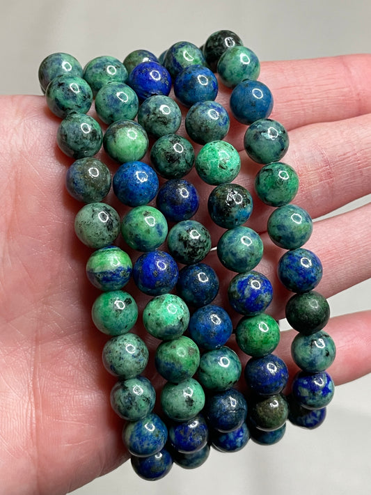 Azurite bracelet with 8mm beads, featuring the deep blue and green hues of Azurite crystals. This bracelet embodies a sense of mystery and natural beauty, making it a captivating accessory for those drawn to earthy elegance.
