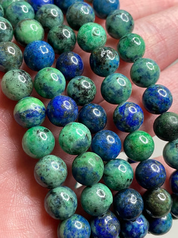 Azurite bracelet with 8mm beads, featuring the deep blue and green hues of Azurite crystals. This bracelet embodies a sense of mystery and natural beauty, making it a captivating accessory for those drawn to earthy elegance.
