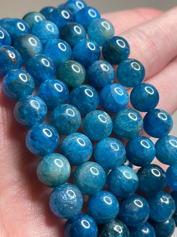 Blue Apatite bracelet featuring 8mm beads, showcasing the captivating blue hues of Apatite crystals. This bracelet combines natural beauty with a touch of vibrant energy, making it a stylish and lively accessory for various occasions.