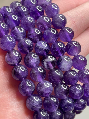 Dark Amethyst bracelet featuring 8mm beads, highlighting the rich and deep purple tones of Amethyst crystals. This bracelet exudes a sense of sophistication and spiritual elegance, making it a striking accessory for various occasions.