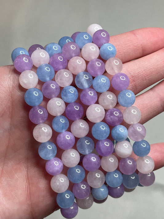 Purple Morganite bracelet adorned with 8mm beads, featuring enchanting lavender hues of purple morganite crystals. This bracelet combines elegance with a touch of serenity, making it a captivating accessory for any occasion.