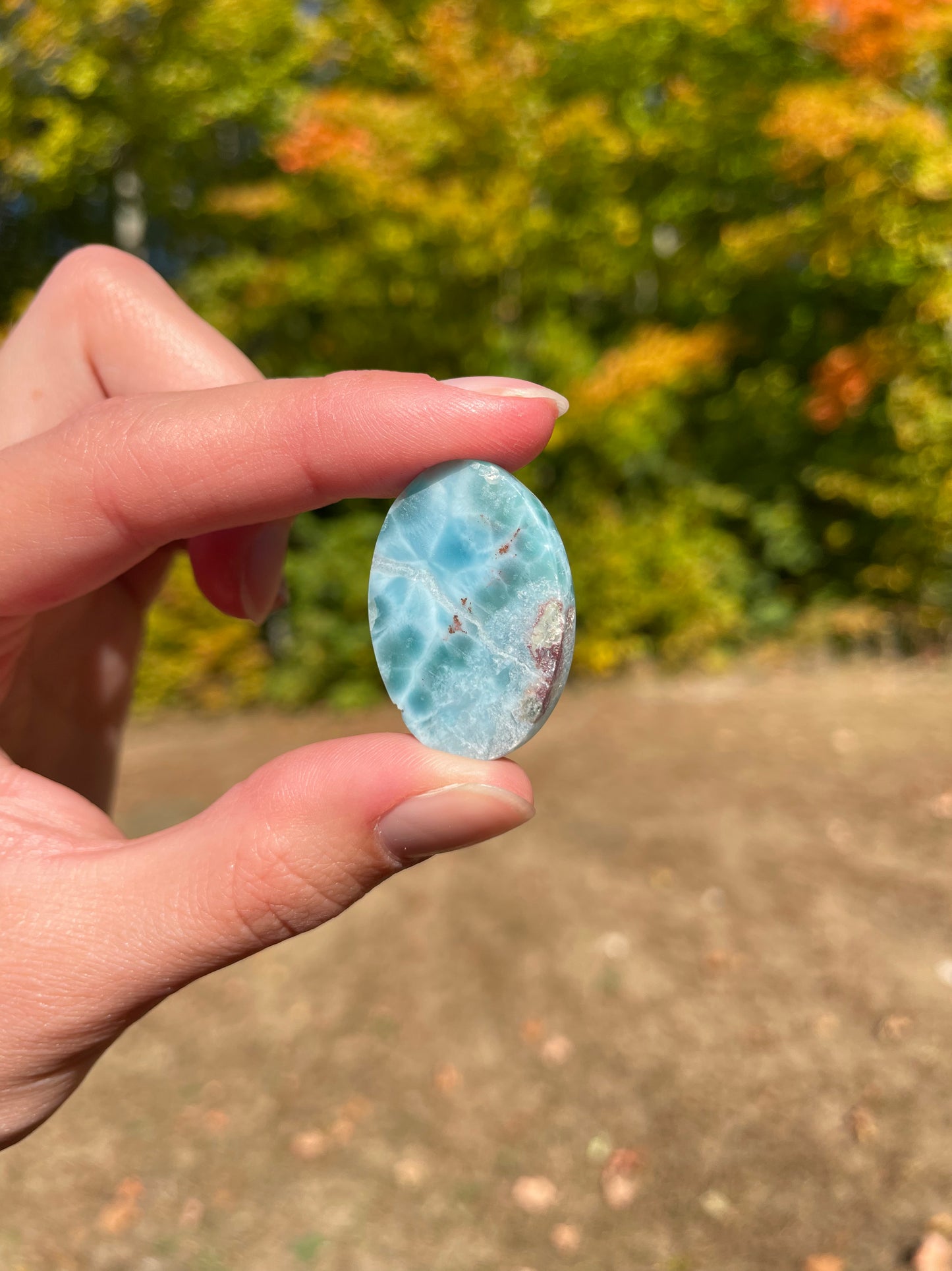 Light blue with soft white lines, oval in shape with polished surface. It has effects on four of the seven Chakras