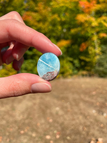 Light blue with soft white lines, round in shape with polished surface. It has effects on four of the seven Chakras