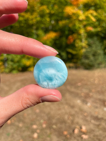 Light blue with soft white lines, round in shape with polished surface. It has effects on four of the seven Chakras