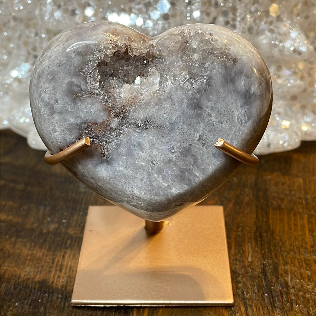 Pink Amethyst druzy hearts elagantly presented on custom metal stands, blending romance and sophistication in a crystalline showcase.