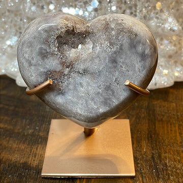 Pink Amethyst druzy hearts elagantly presented on custom metal stands, blending romance and sophistication in a crystalline showcase.