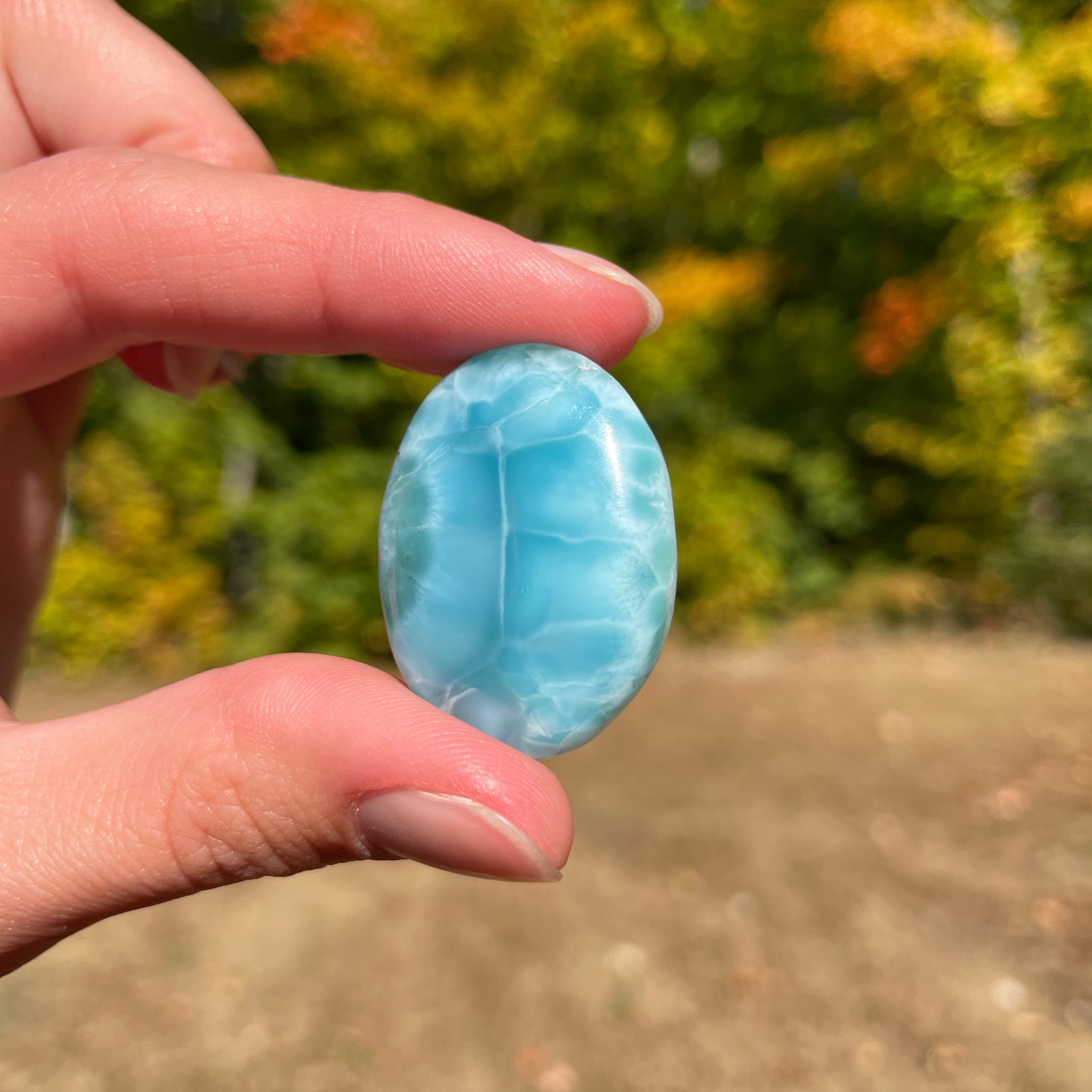 Super blue with soft white lines, oval in shape with polished surface. It has effects on four of the seven Chakras