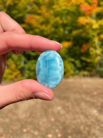 Super blue with soft white lines, oval in shape with polished surface. It has effects on four of the seven Chakras