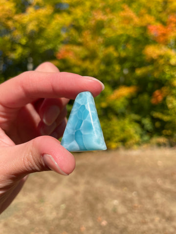 Light blue with soft white lines, triangular in shape with polished surface. It has effects on four of the seven Chakras