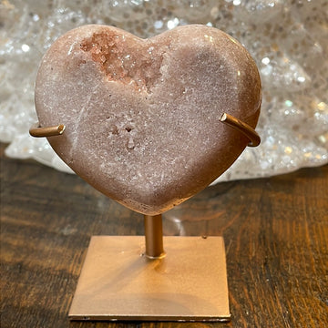 Pink Amethyst druzy hearts elagantly presented on custom metal stands, blending romance and sophistication in a crystalline showcase.